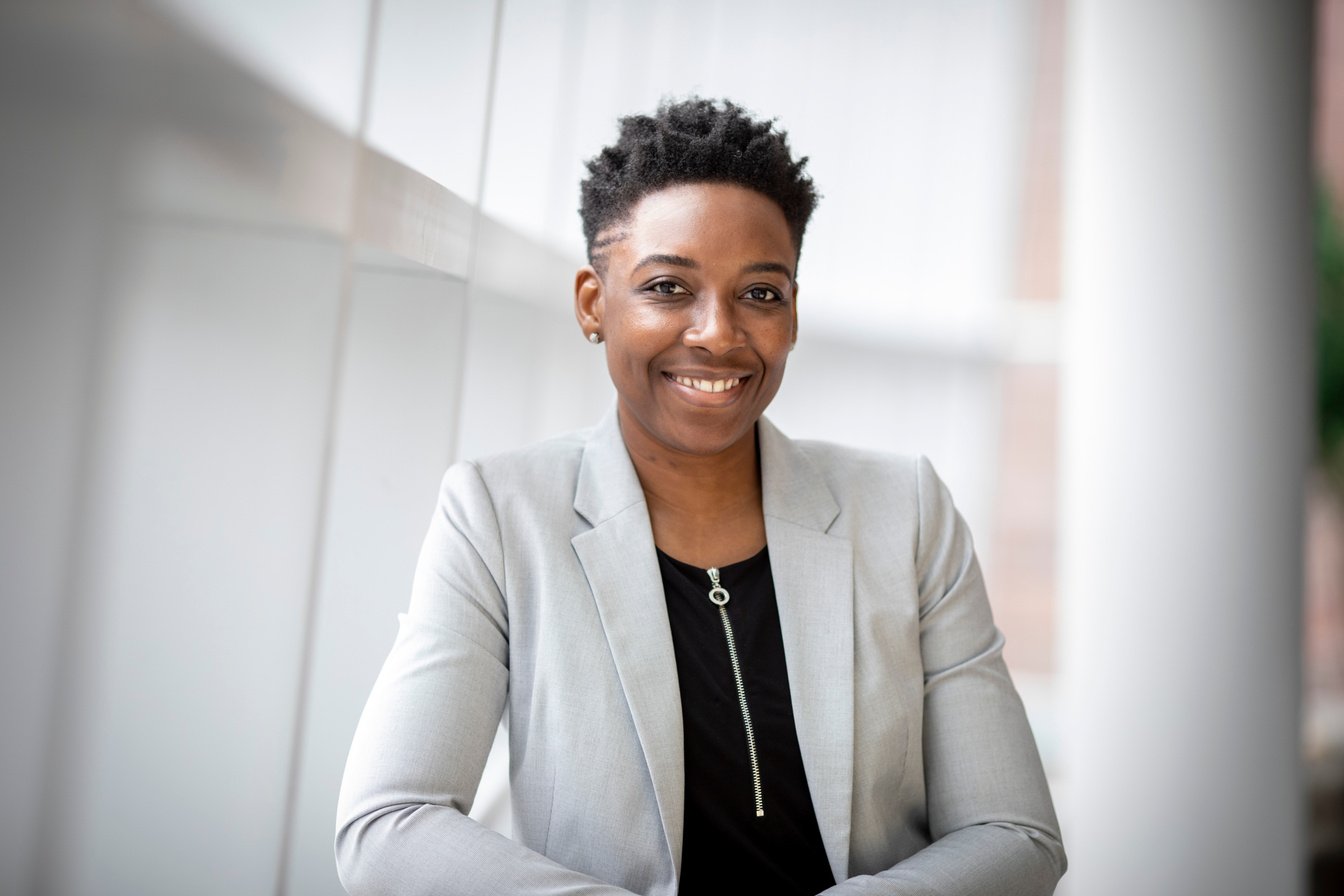 Woman Wearing Gray Notch Lapel Suit Jacket